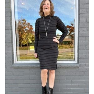 Striped jersey knit dress. Never worn. Tag on. Canadian made. Size medium.